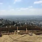 Hillside pool construction with caissons and retaining walls