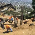 Hillside construction in the Hollywood Hills including caisson drilling and installation